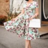 The Bombshell Flower Print Swing Dress In White